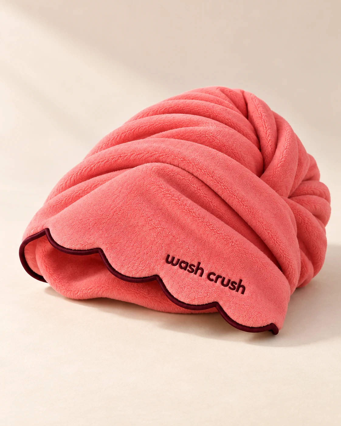 Guava coral pink Wrap Crush hair towel, softly folded to show its scalloped edge